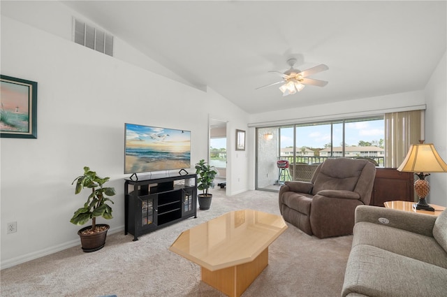 carpeted living room featuring ceiling fan and vaulted ceiling