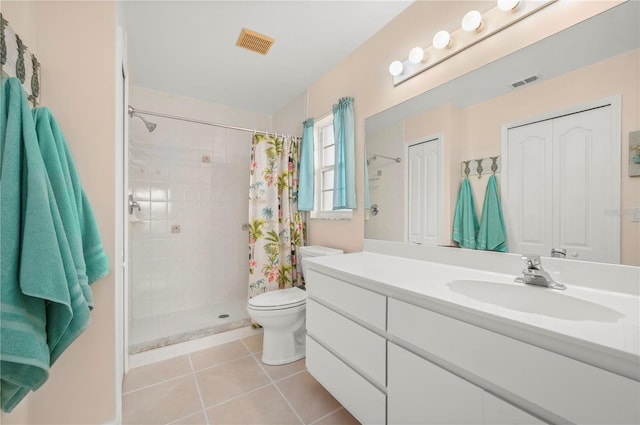 bathroom featuring toilet, tile patterned flooring, vanity, and a shower with shower curtain