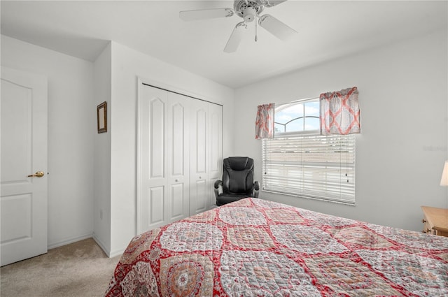 bedroom featuring a closet, light carpet, and ceiling fan