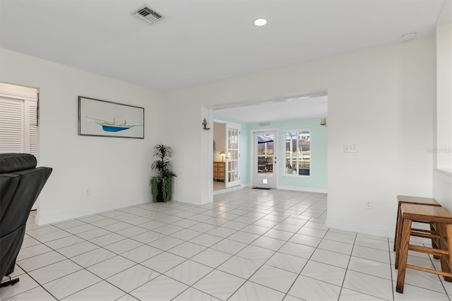 interior space with recessed lighting, visible vents, baseboards, and light tile patterned floors