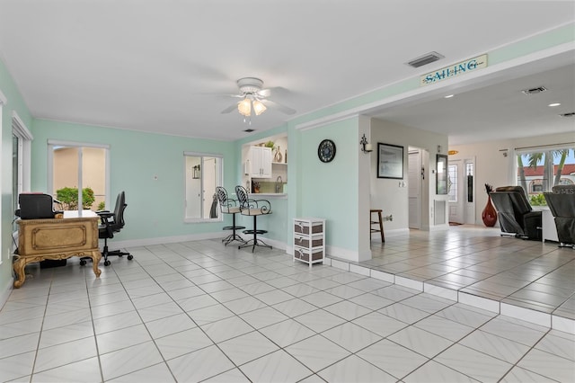 office area featuring visible vents, ceiling fan, baseboards, and light tile patterned floors