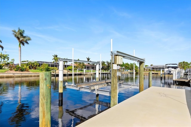 dock area featuring a water view and boat lift