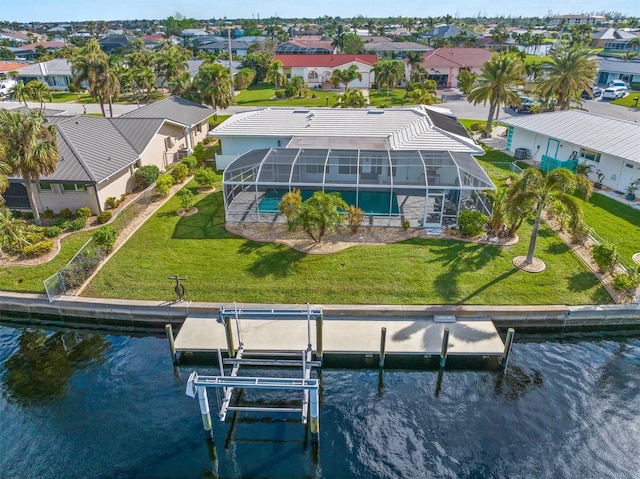 drone / aerial view featuring a residential view and a water view