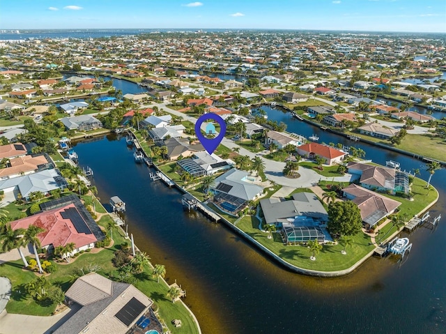 bird's eye view with a water view and a residential view