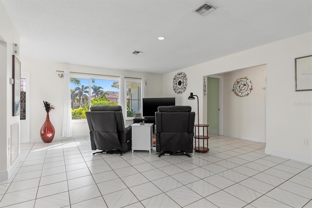 living area with recessed lighting, visible vents, baseboards, and light tile patterned floors