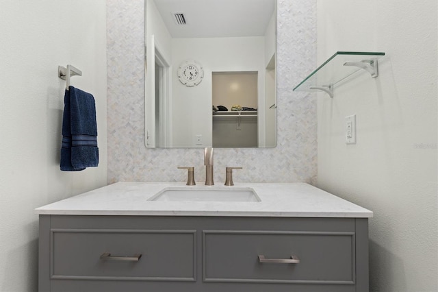 bathroom featuring vanity and visible vents