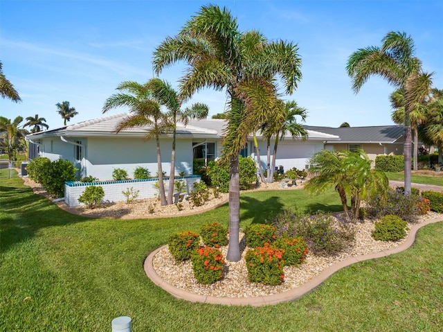 single story home featuring a front yard and stucco siding