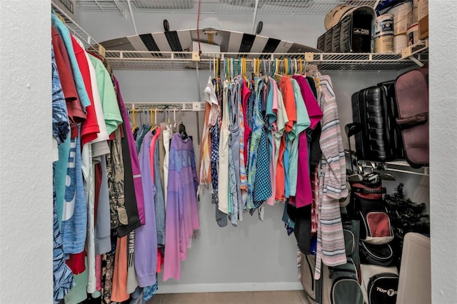 spacious closet featuring tile patterned floors