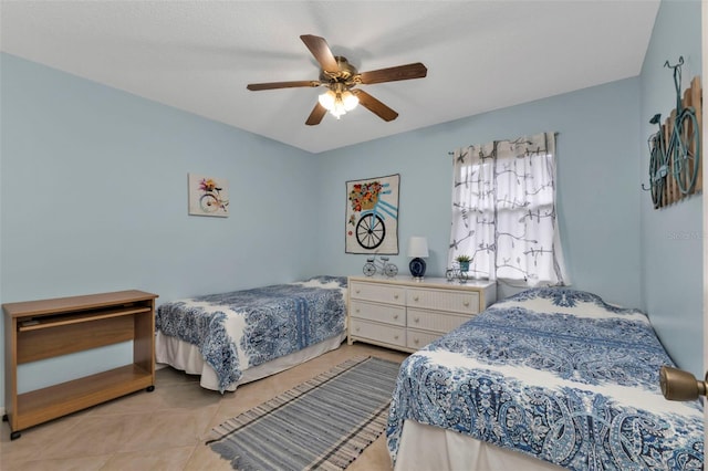 bedroom featuring ceiling fan and light tile patterned floors