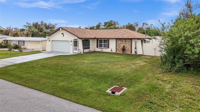 ranch-style house featuring a front yard and a garage