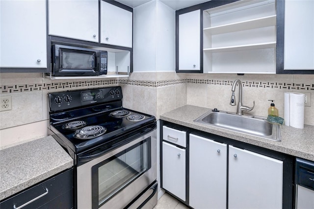 kitchen with white cabinetry, tasteful backsplash, black appliances, and sink