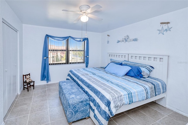 tiled bedroom with ceiling fan