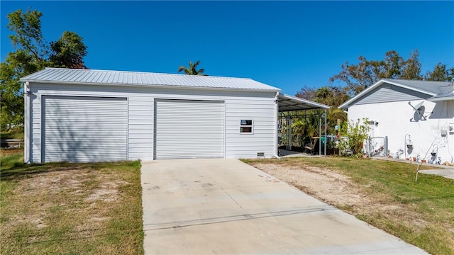 garage featuring a yard