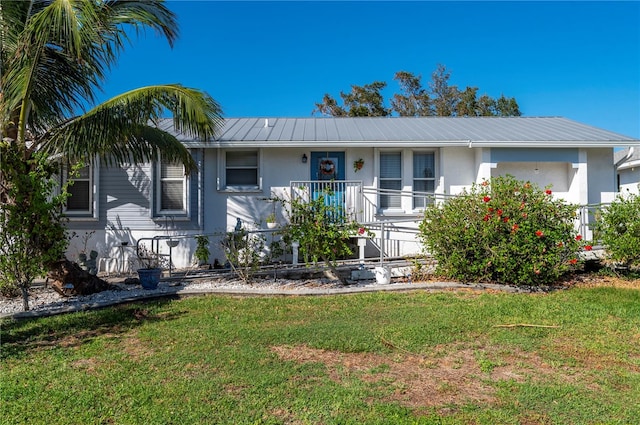 ranch-style house with a front lawn