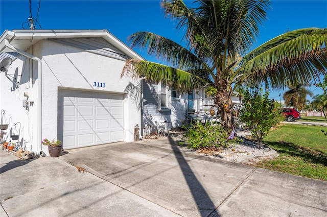 view of side of property featuring a garage