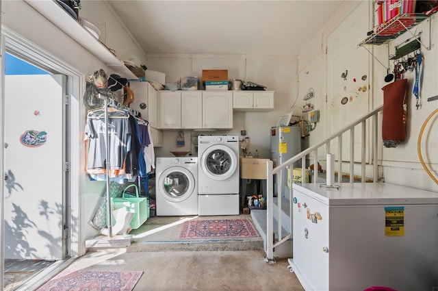 laundry room with cabinets, sink, and washer and clothes dryer