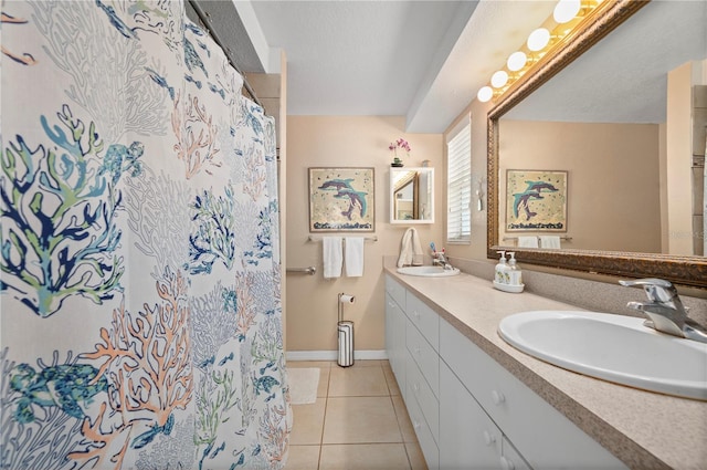 bathroom with vanity, tile patterned floors, and walk in shower