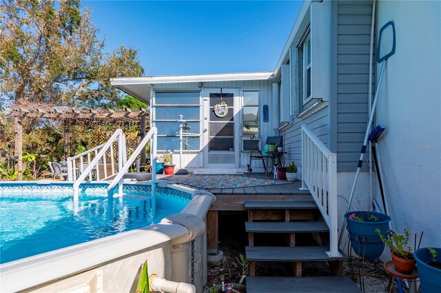 view of pool featuring a wooden deck