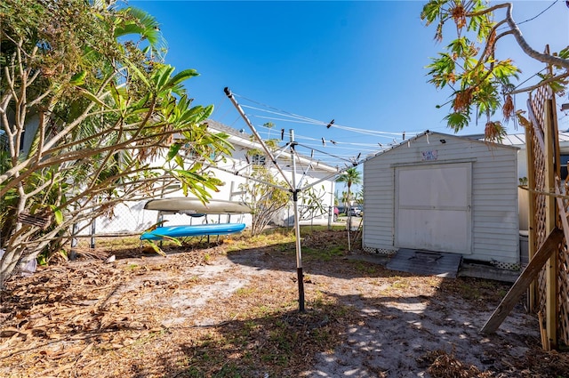 view of yard with a storage unit