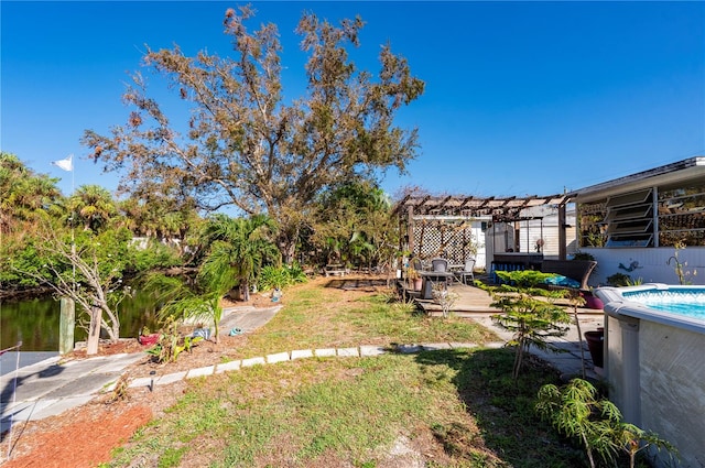 view of yard with a pergola and a patio