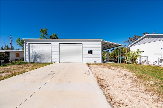 garage featuring a carport