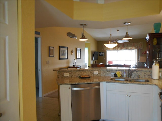 kitchen featuring sink, hanging light fixtures, white cabinetry, stainless steel dishwasher, and light stone counters