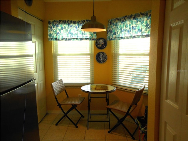 dining space with light tile patterned floors