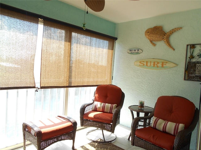 sitting room with ceiling fan