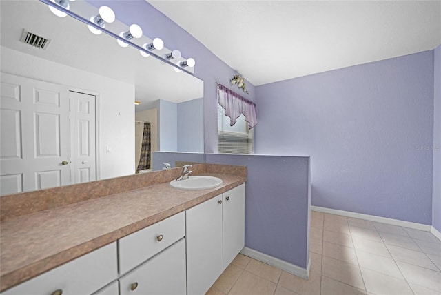 bathroom featuring vanity and tile patterned flooring