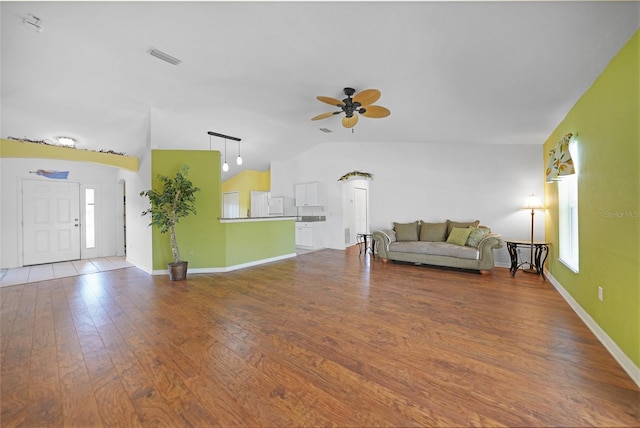 unfurnished living room featuring ceiling fan, hardwood / wood-style flooring, and lofted ceiling