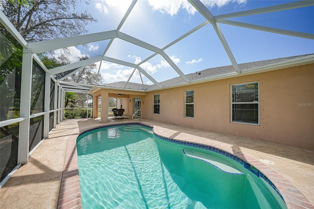 view of pool featuring a patio and a lanai