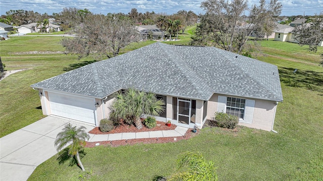 view of front facade with a front lawn and a garage