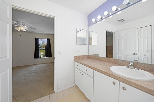 bathroom featuring vanity, ceiling fan, and tile patterned flooring