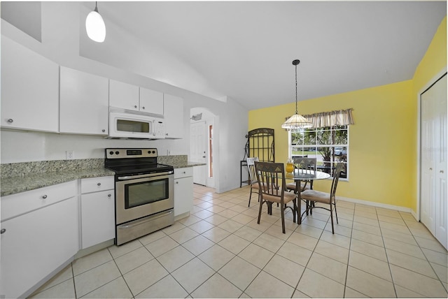 kitchen featuring lofted ceiling, white cabinets, stainless steel range with electric stovetop, and decorative light fixtures