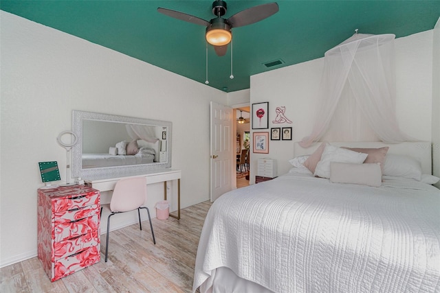 bedroom featuring ceiling fan and light hardwood / wood-style flooring