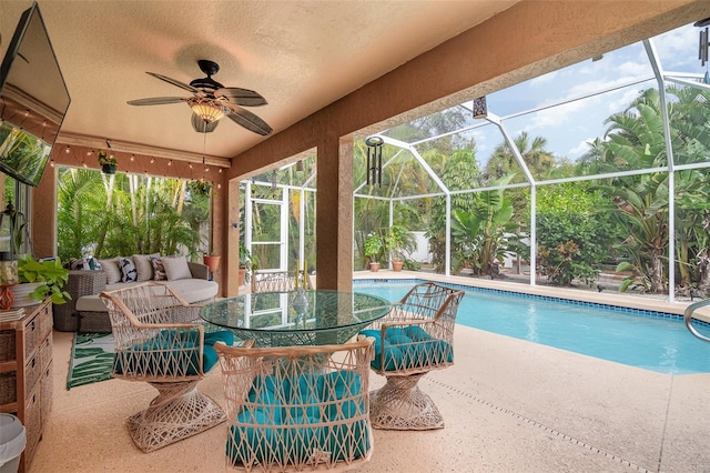 view of swimming pool featuring an outdoor hangout area, a patio area, a lanai, and ceiling fan