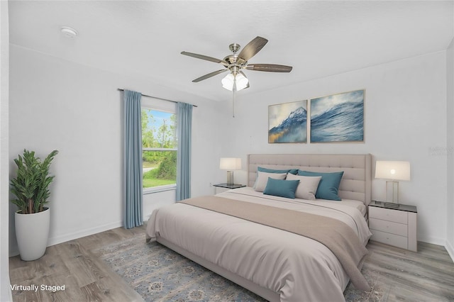 bedroom featuring light hardwood / wood-style flooring and ceiling fan