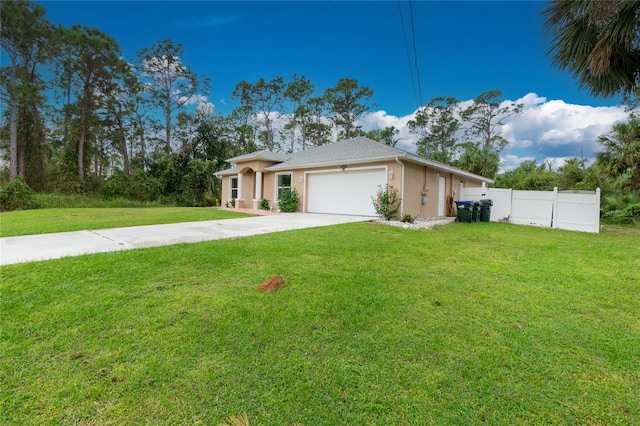 view of front of property featuring a front yard and a garage