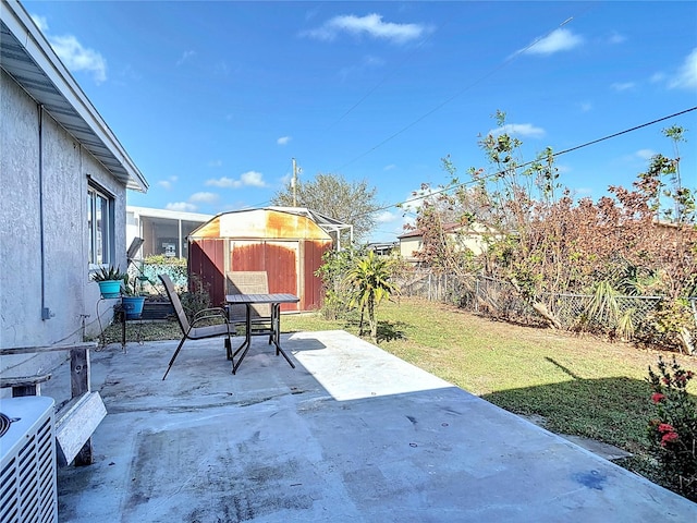 view of patio featuring a storage shed