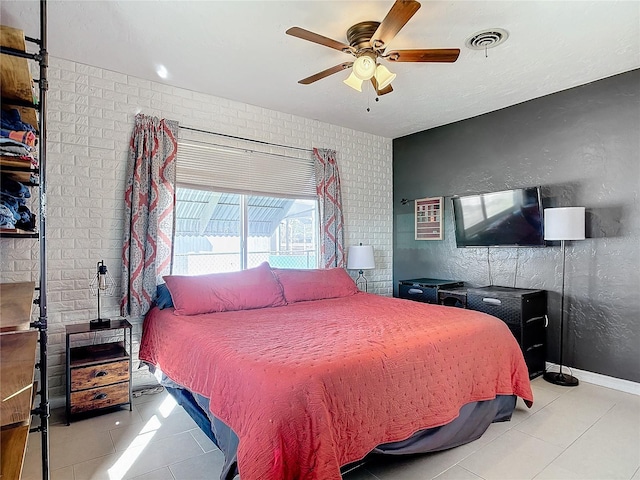 tiled bedroom with ceiling fan