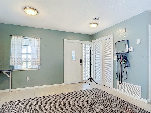 view of tiled foyer entrance