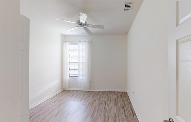 empty room with light wood-type flooring and ceiling fan