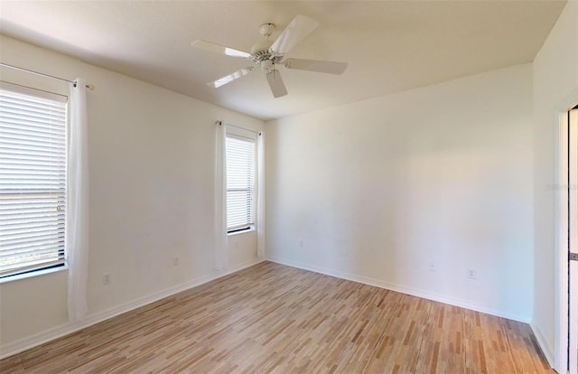 unfurnished room with ceiling fan and light hardwood / wood-style flooring