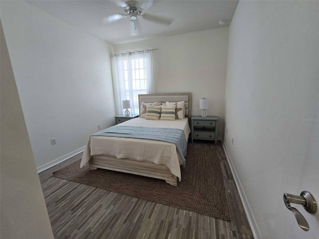 bedroom with baseboards, wood finished floors, and ceiling fan