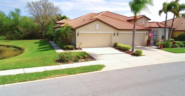 view of front of home with stucco siding, a tiled roof, driveway, a front yard, and an attached garage