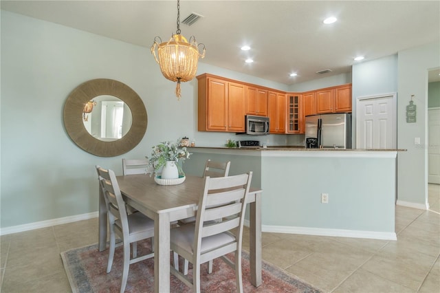 2765 Arugula Dr, North Port, FL 34289 - dining room featuring recessed lighting, light tile patterned floors, baseboards, and a chandelier