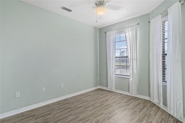 2765 Arugula Dr, North Port, FL 34289 - empty room featuring wood finished floors, ceiling fan, and baseboards