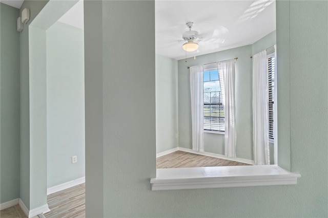 2765 Arugula Dr, North Port, FL 34289 - spare room featuring baseboards, ceiling fan, and wood finished floors