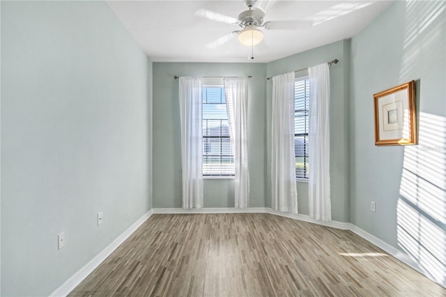 2765 Arugula Dr, North Port, FL 34289 - spare room with wood finished floors, baseboards, and ceiling fan