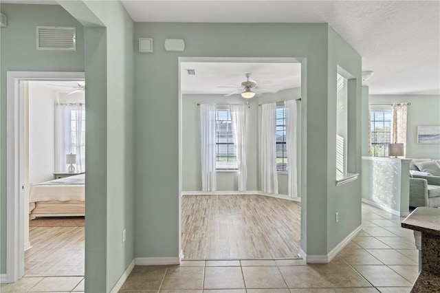 2765 Arugula Dr, North Port, FL 34289 - hallway featuring baseboards and tile patterned floors